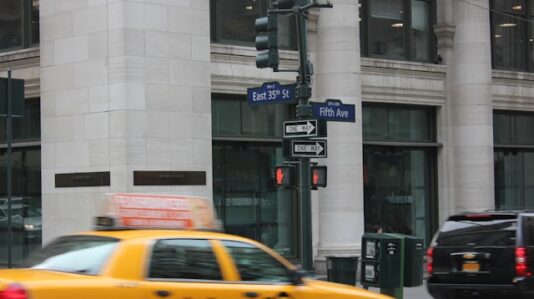 a yellow cab at 5th Ave. in NY