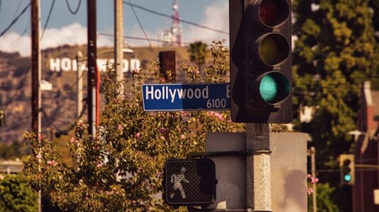 Hollywood sign next to a traffic light