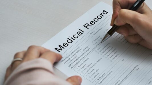 someone filling a medical record