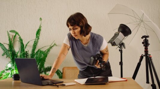 a woman checking her laptop