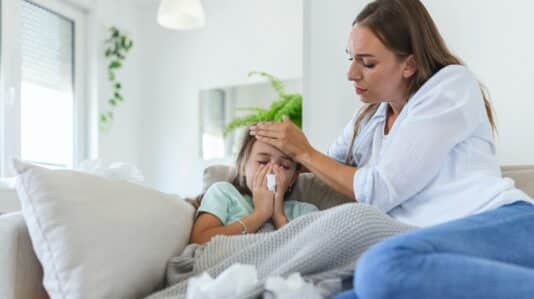 a mother taking care of a sick daughter