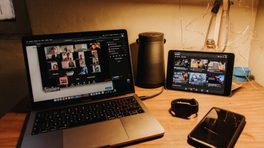 desk with laptop, tablet and mobile phone