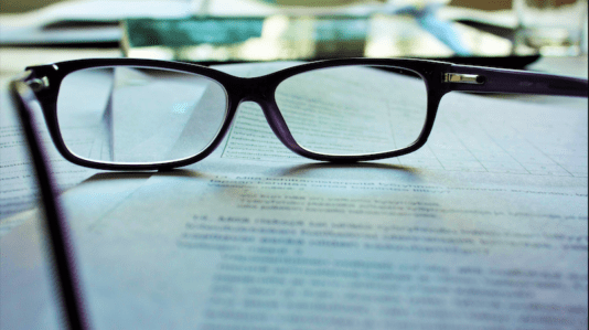 reading glasses lying on table
