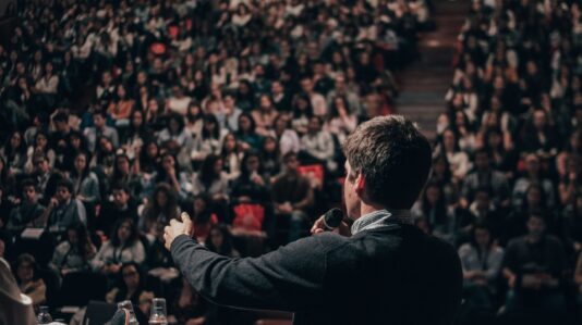 man talking to a crowd