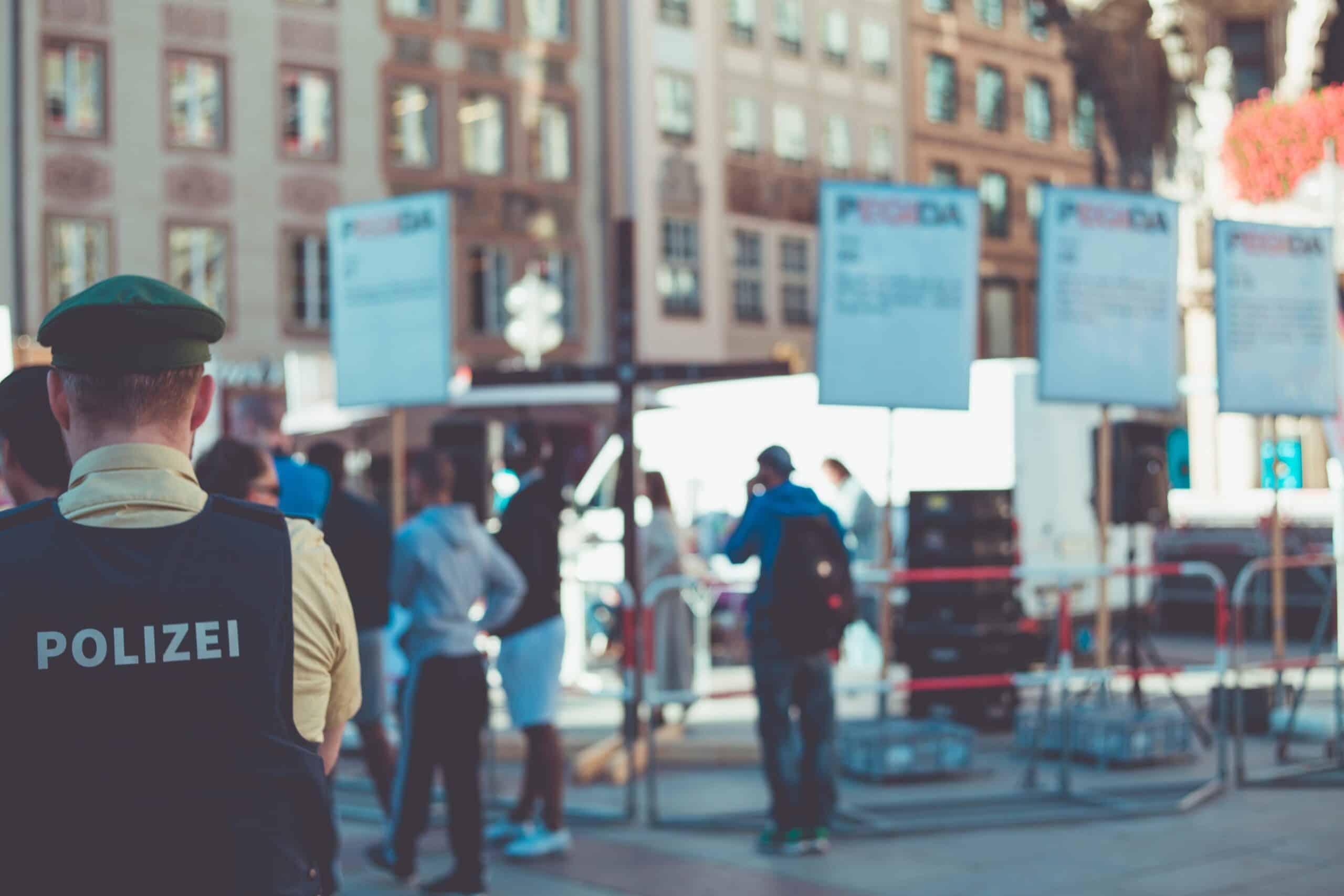 people walking in the street near building