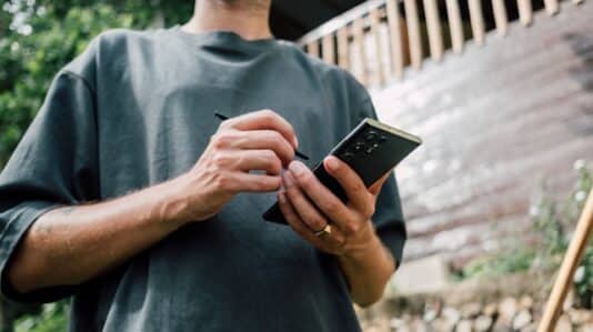 a man holding a mobile phone