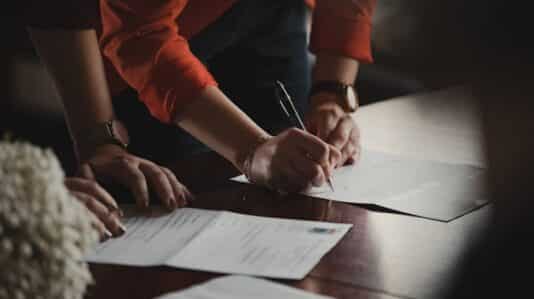 people signing a contract