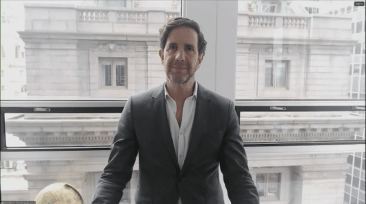a man standing with building background