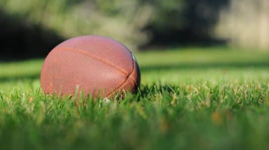 a football ball in the grass