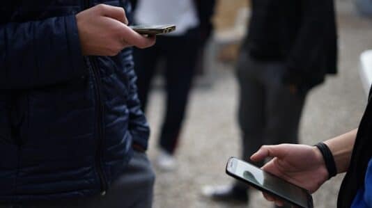 people using mobile phones