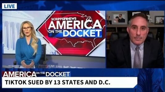 Dave Fish being interviewed by a female host
