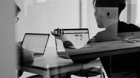 a meeting using laptop