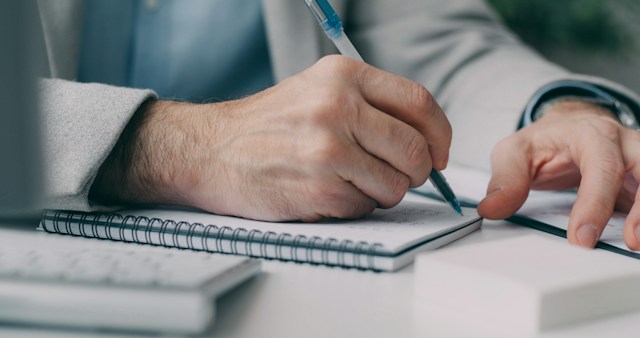 a person signing a document