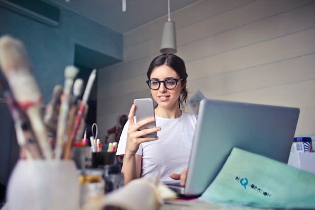 a social influencer holding a mobile phone