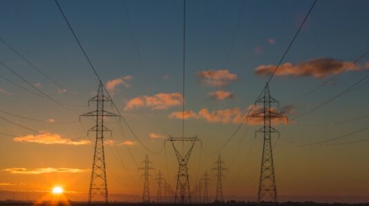 Power pylons at sunset