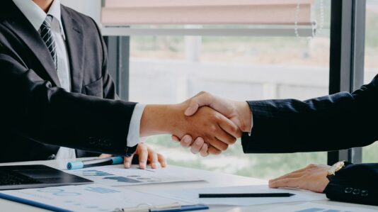 two people shaking hands
