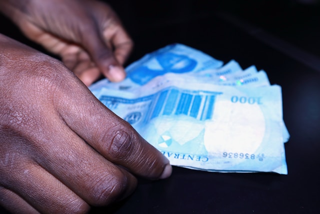 hands holding money