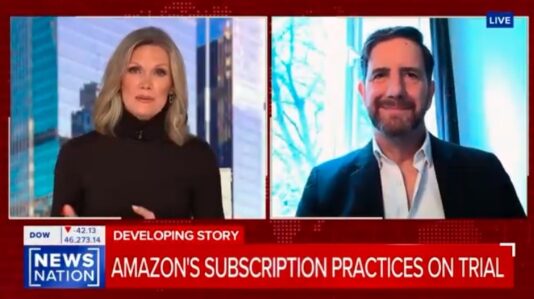a woman anchor interviewing Domenic Romano