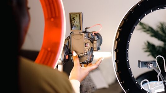 a vlogger adjusting the camera