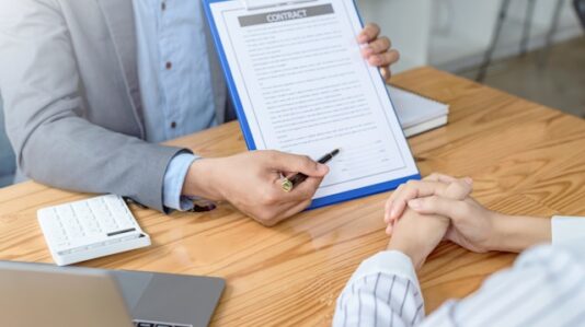 a person showing and explaining a contract
