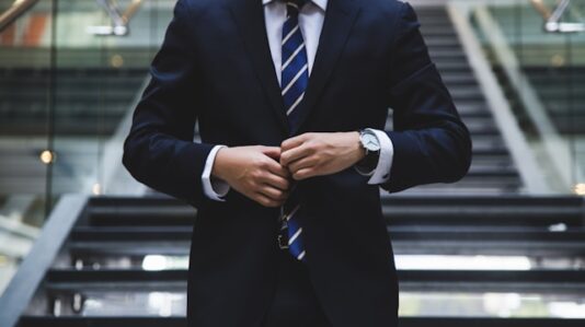 a man fixing his suit