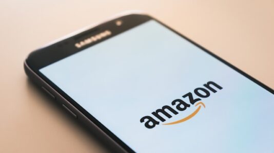 a mobile phone with Amazon app open