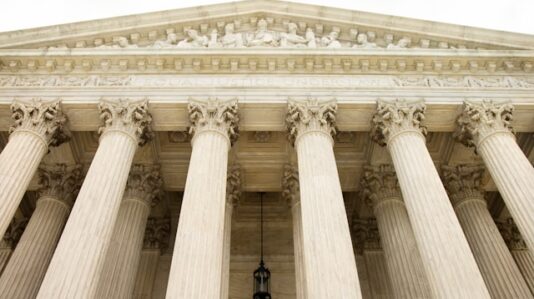 front facade of a large neoclassical building with tall columns