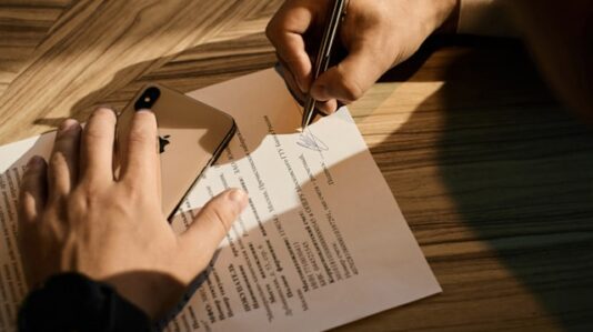 a person signing a document