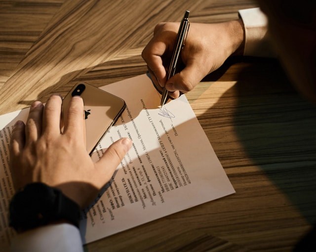 a person signing a document