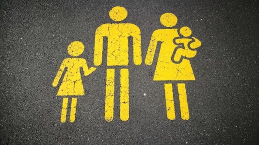 drawing of a family with the mother carrying a baby