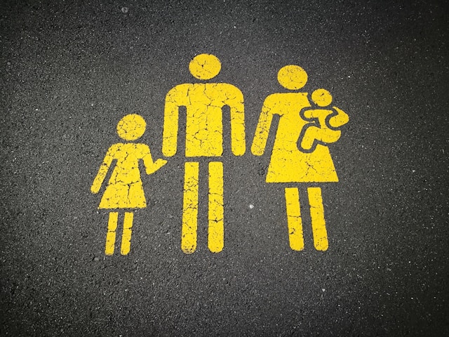 drawing of a family with the mother carrying a baby