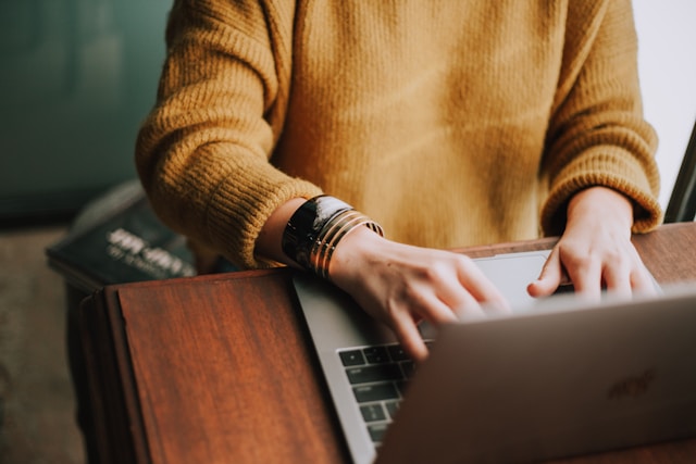a person doing some work on a laptop