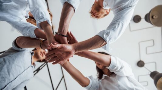 a team putting their hands together