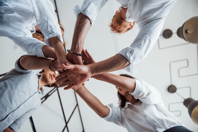 a team putting their hands together