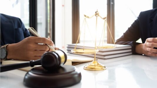 judge gavel and scale of justice on the table