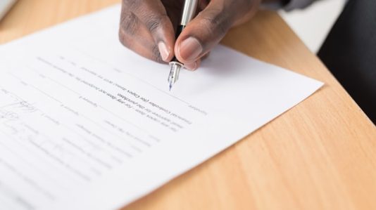 Man preparing to sign a contract