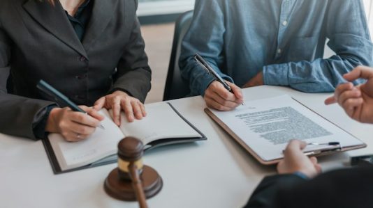 two people reviewing document