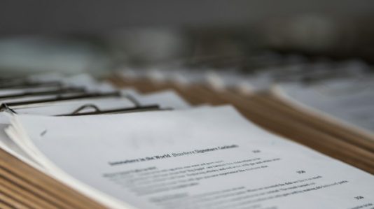 lots and lots of clip board with documents