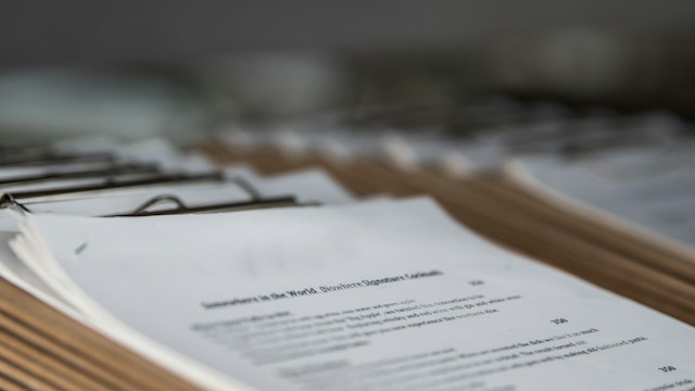 lots and lots of clip board with documents